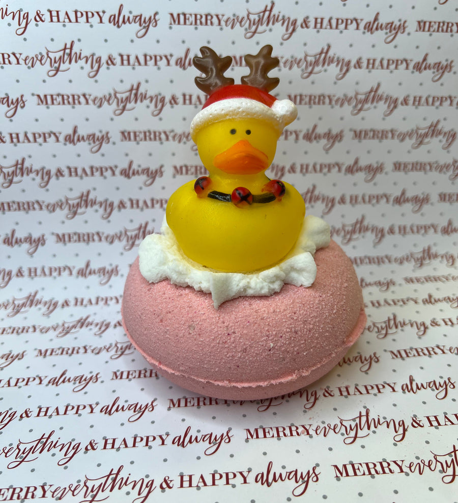 VKD Artisan Christmas Bath Bomb - reindeer rubber ducky on white bubble bar and pink bath bomb.